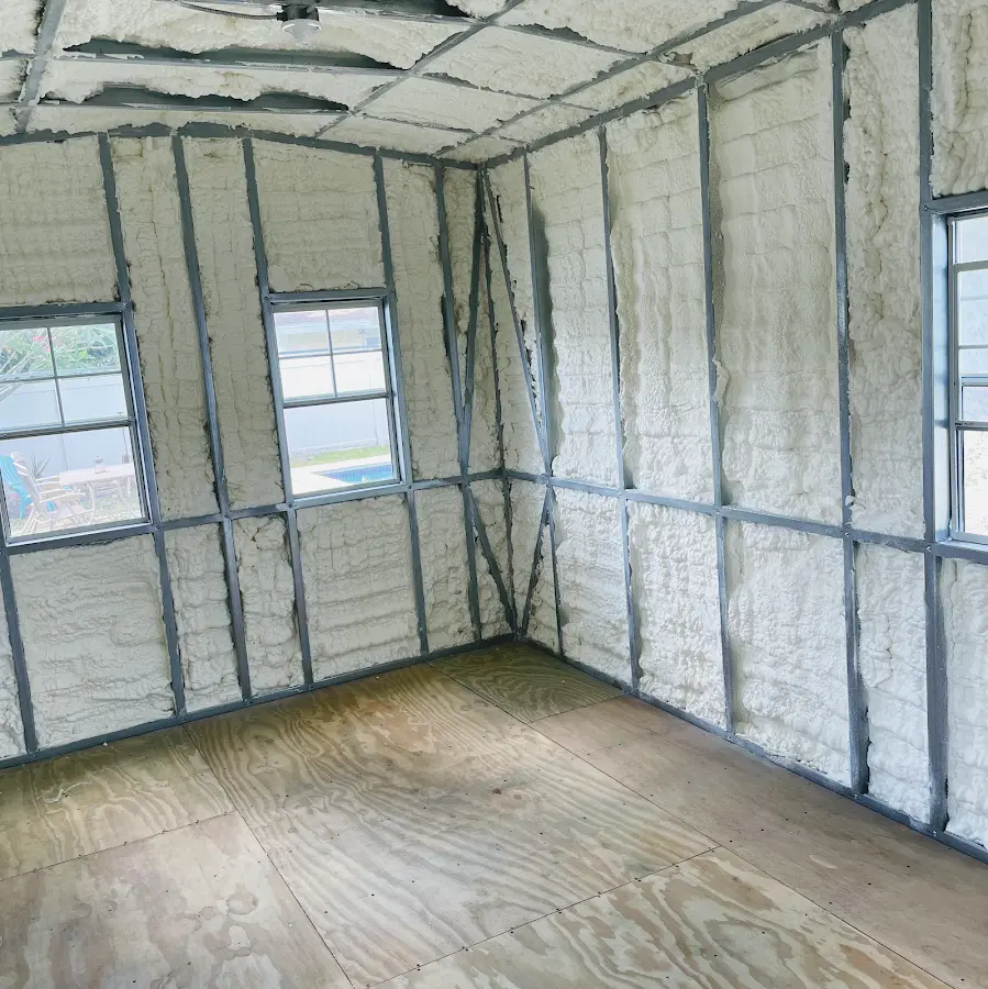Closed-cell spray foam insulation applied to wall cavities in a residential project in Mooresville